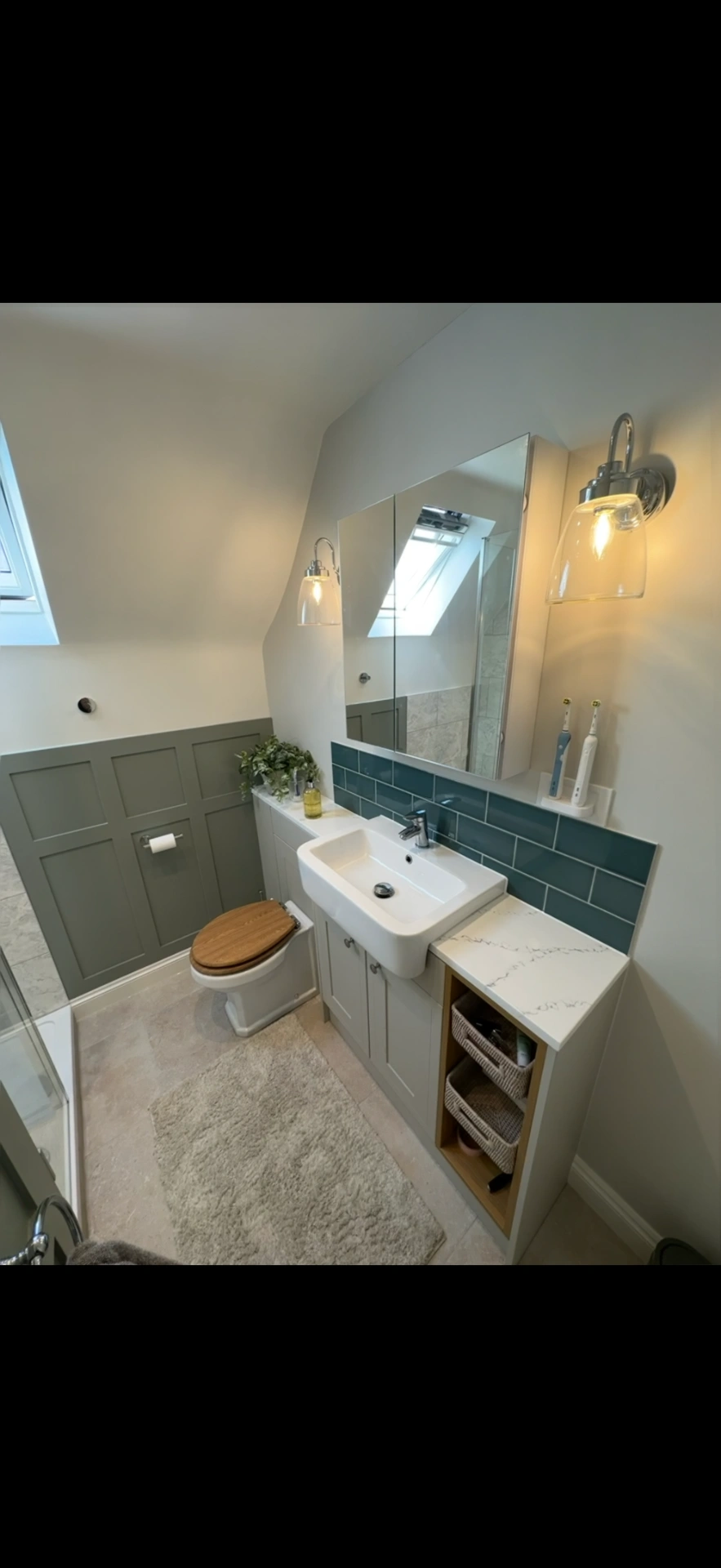Loft cloakroom with sage panelling, teal tiles and fitted vanity — Godalming bathroom installers