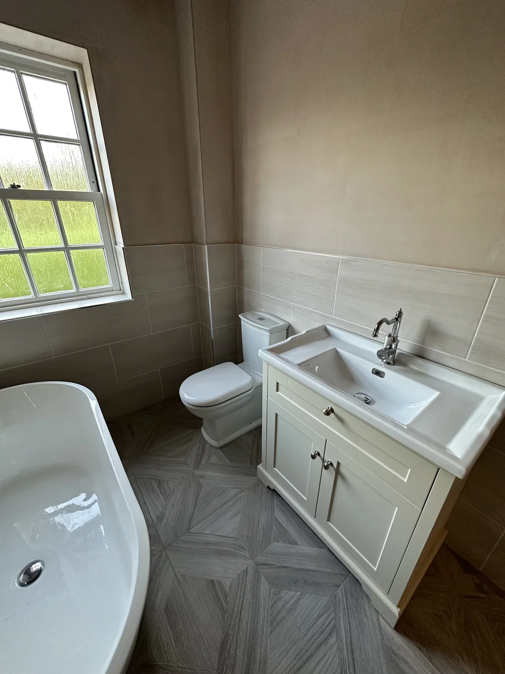 Traditional bathroom with cream shaker vanity, chrome tap and parquet floor — bathroom renovation Godalming